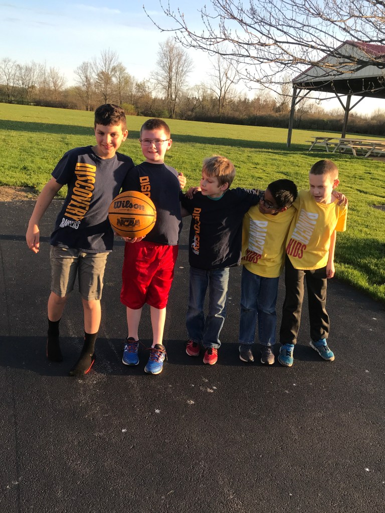 Ranger boys holding a  basketaball